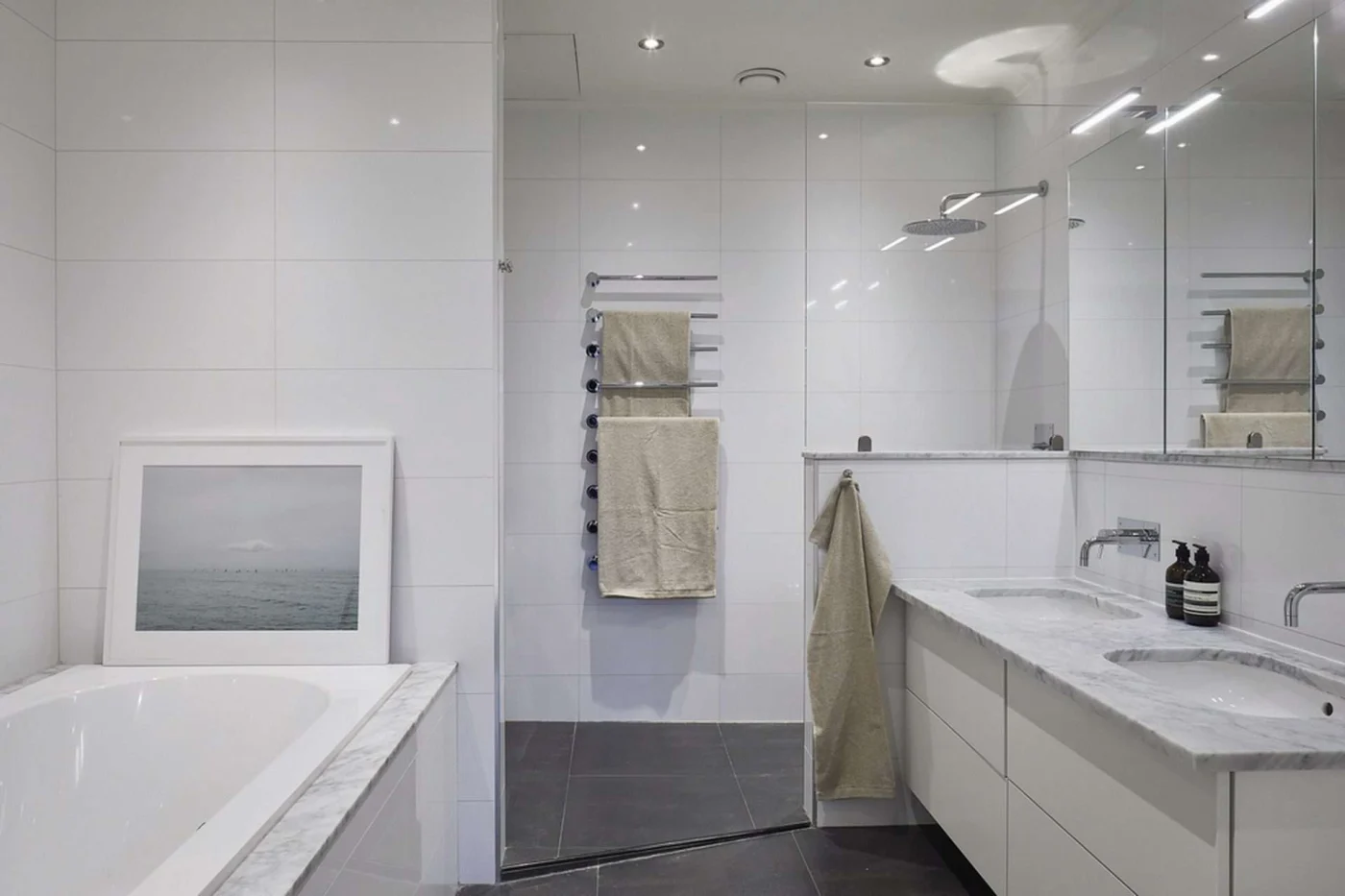 Contemporary bathroom with minimalist design featuring both bathtub and shower options