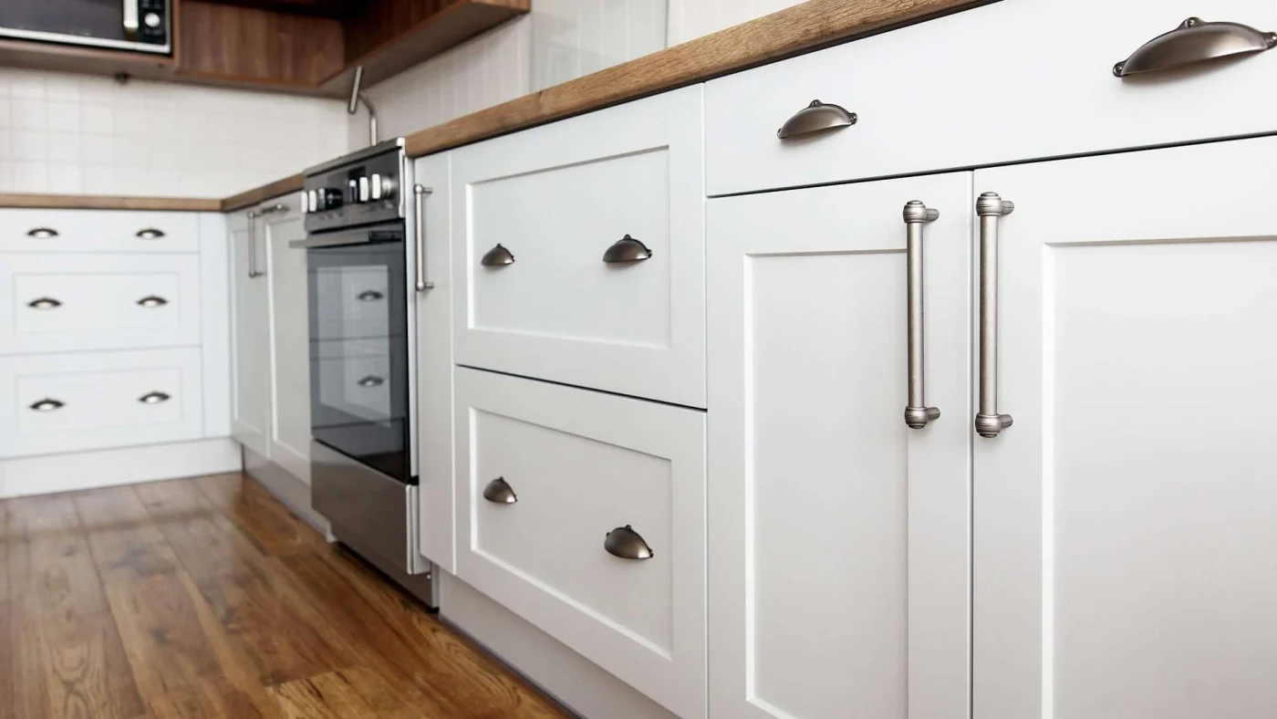 New white cabinets and brown flooring