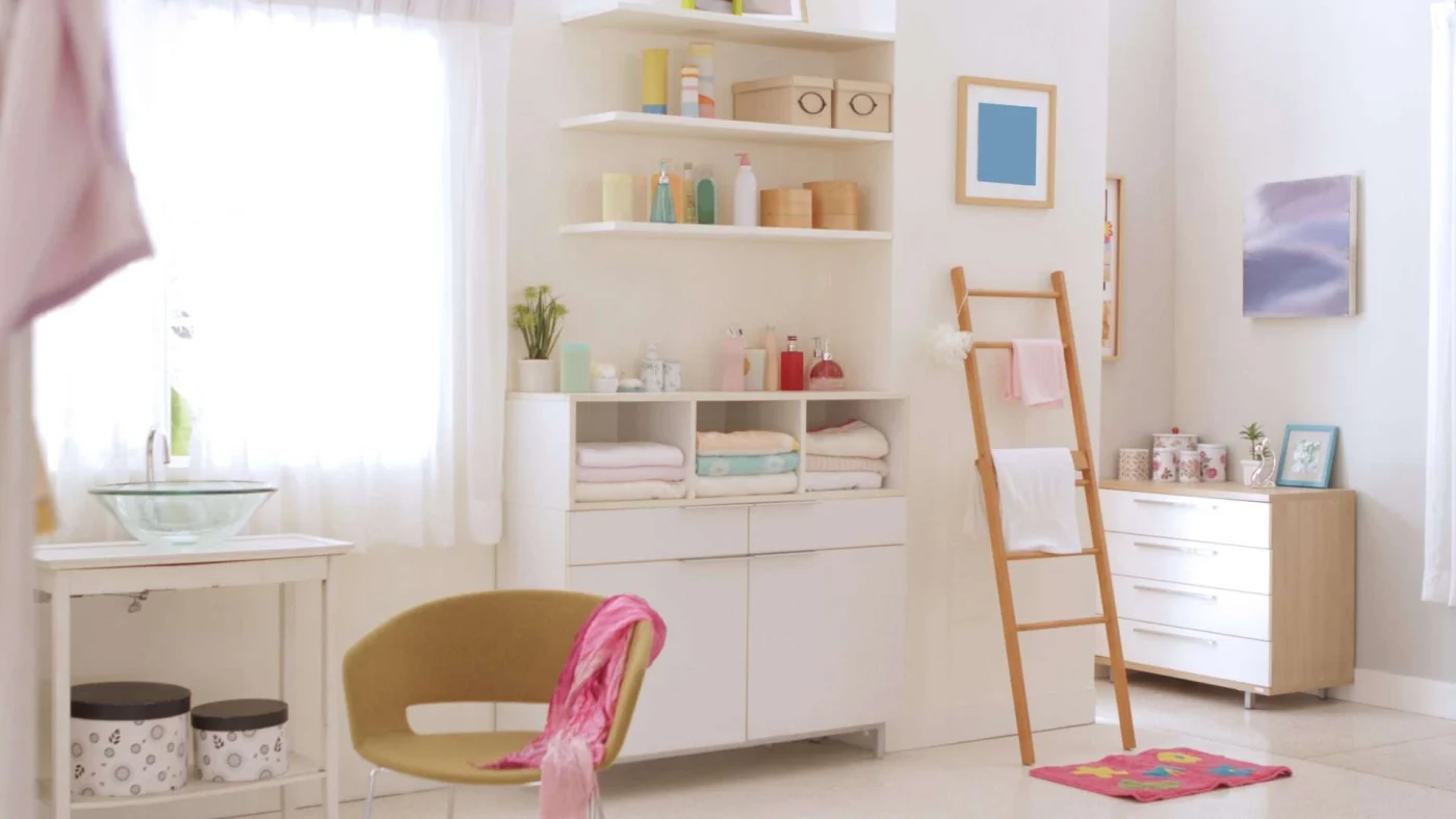 The storage area of a bathroom with a large cabinet filled with towels and bath products