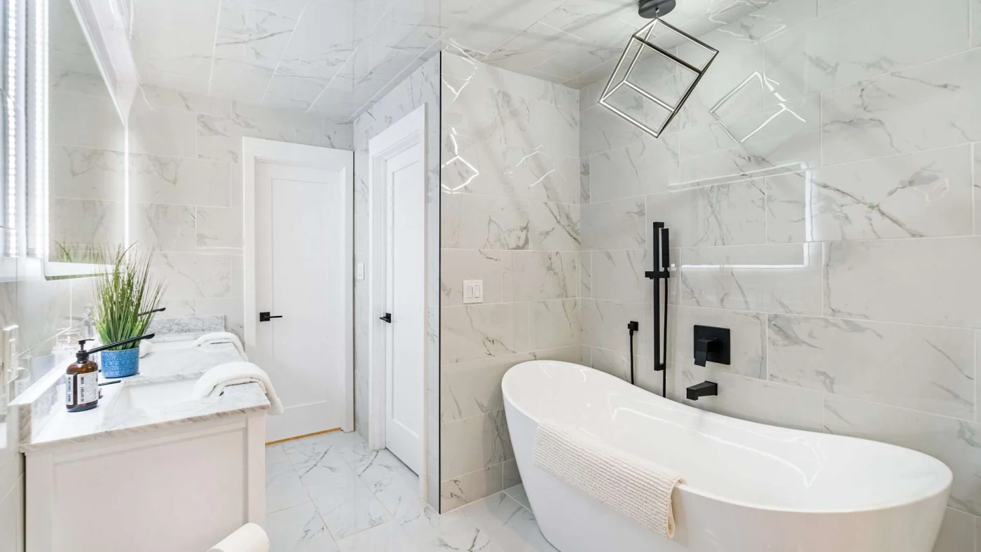 A white themed bathroom with a soaker tub
