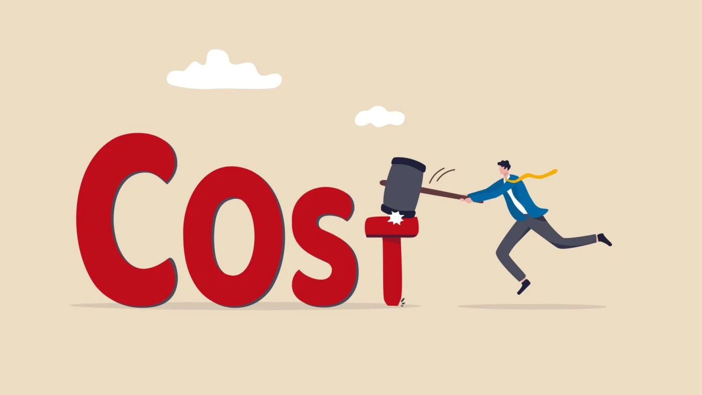 The word “Cost” with letters decreasing in size and a man in a business suit striking the “T” with a mallet