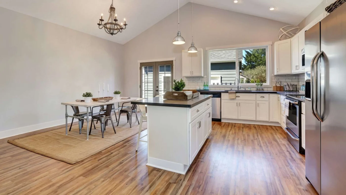 Newly remodeled kitchen with wood flooring and beautiful large windows