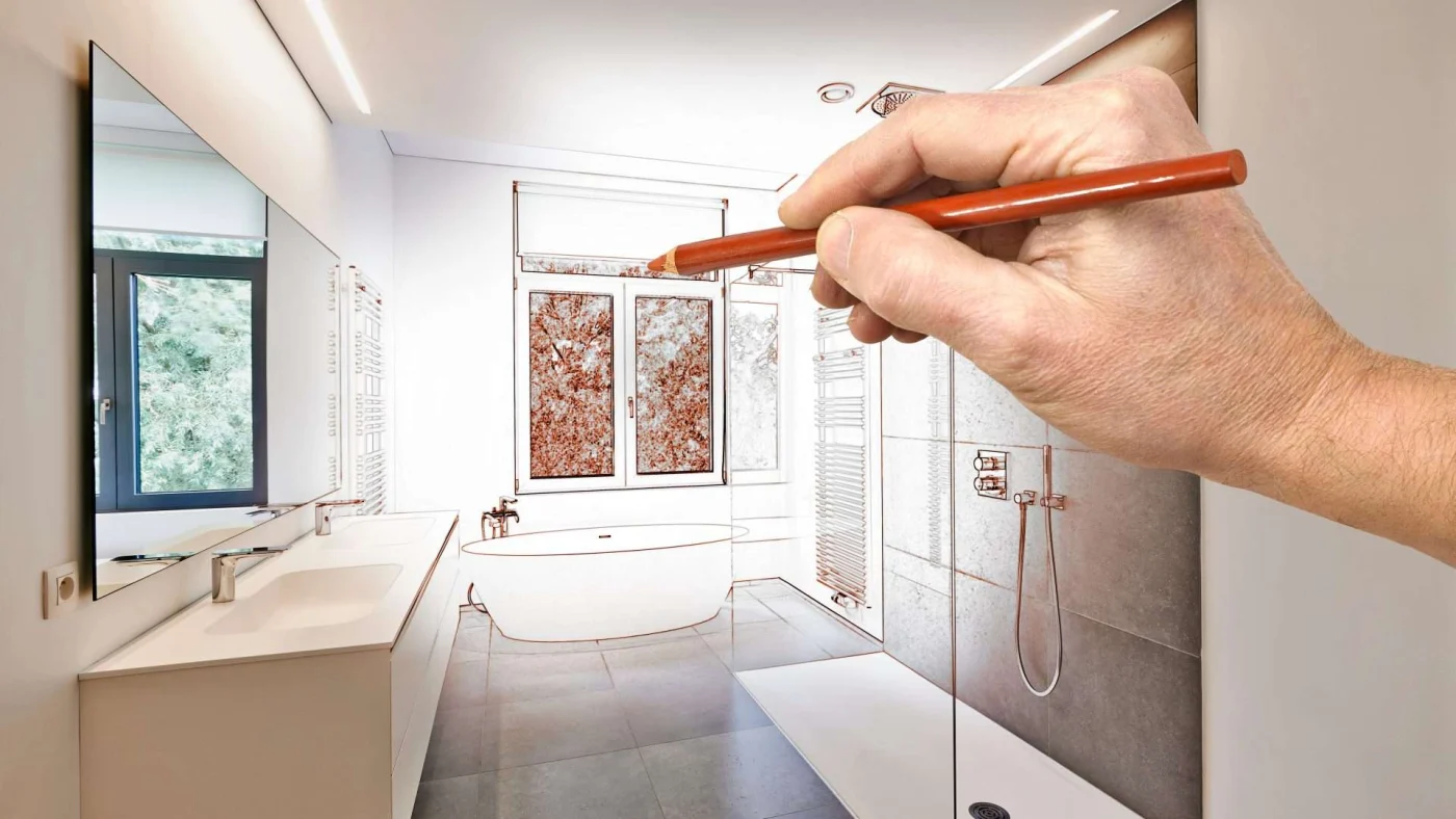 A hand finishes the design sketch of a luxury bathroom remodel