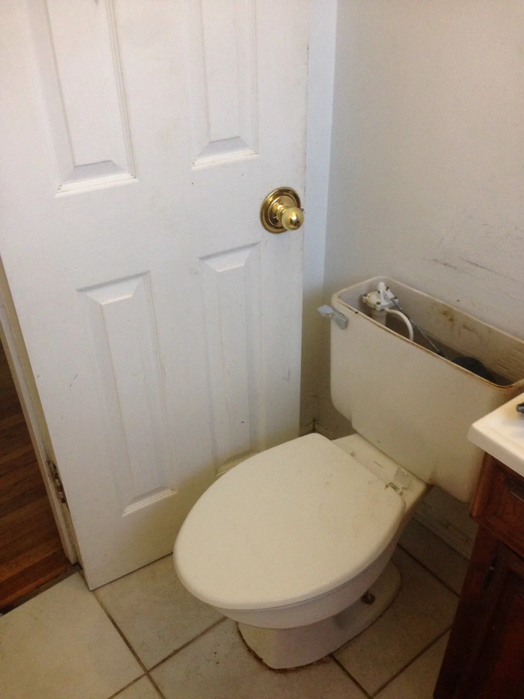 Bathroom door blocked by toilet