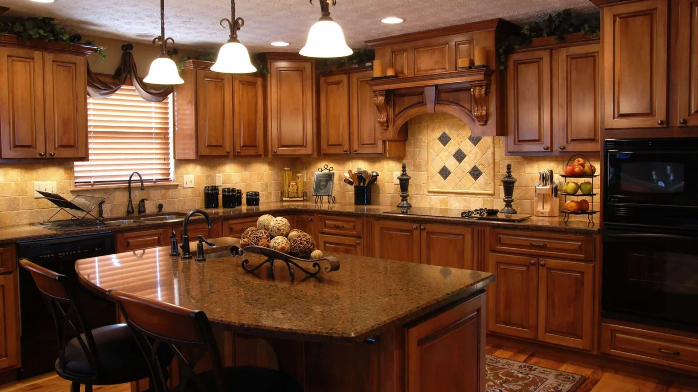 Stunning kitchen remodel with beautiful dark wooden cabinets and marble countertops