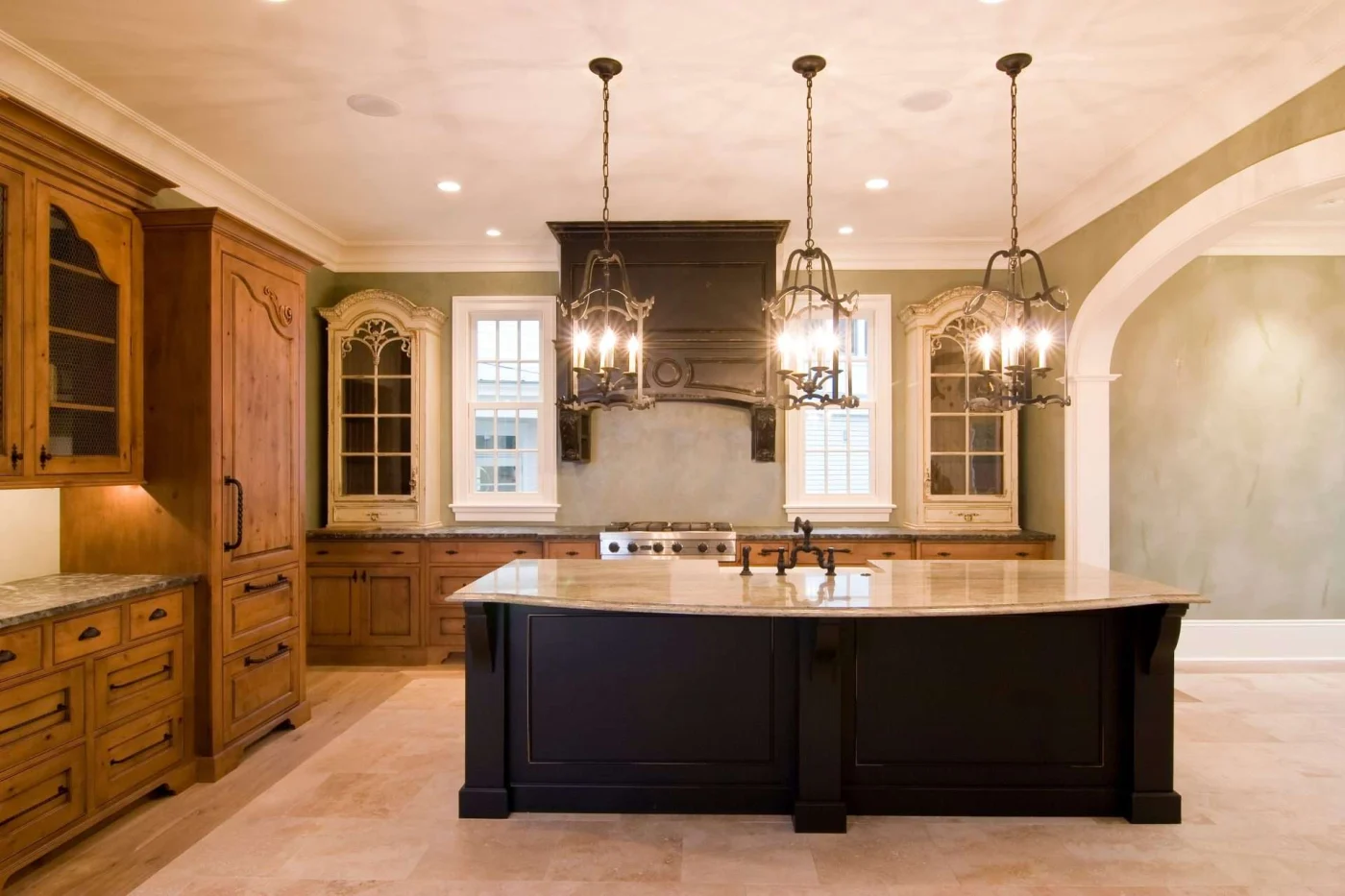 Rustic kitchen with ivory walls and granite kitchen island