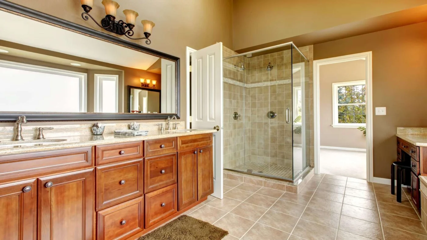A bathroom with a large vanity and walk-in shower