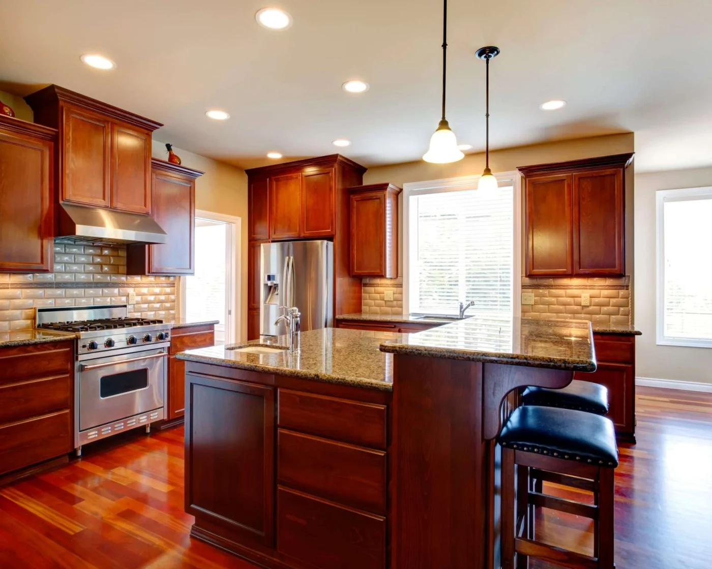 Modern remodeled kitchen with dark oak cabinets and kitchen island