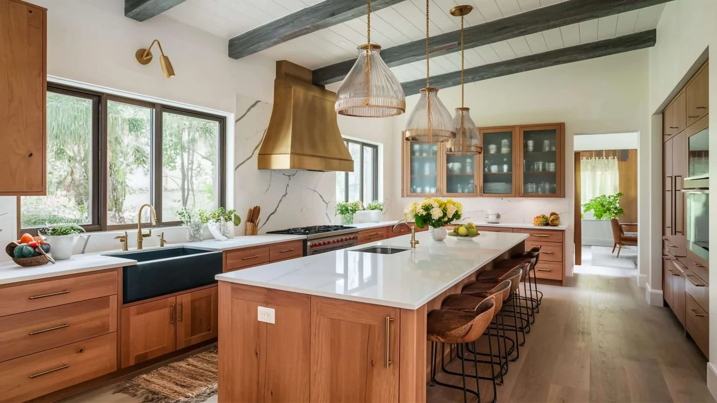 Large home kitchen with beautiful wooden cabinetry, white countertops, and wood bar stool seating
