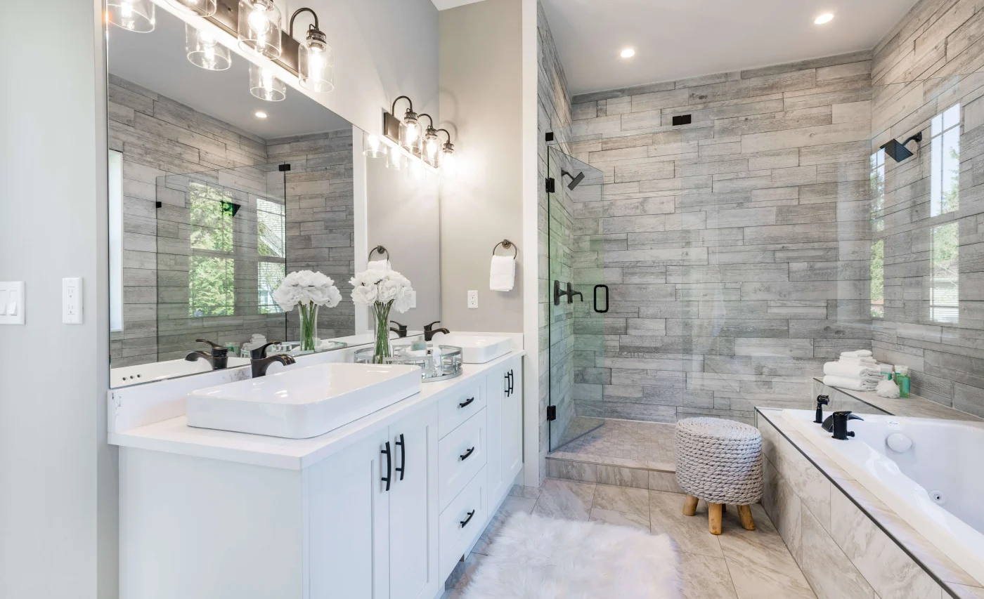 White and marble bathroom with stand-alone tub and walk-in shower