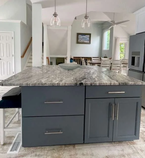 Soft lighting over smooth, elegant granite countertops.