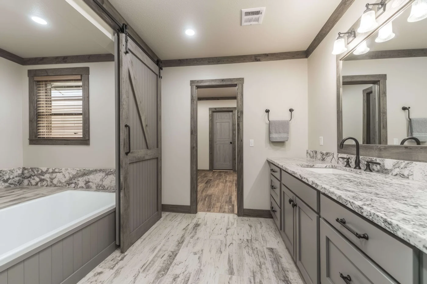 A bathroom remodel, completed in neutral colors for a calm and serene bathroom experience.